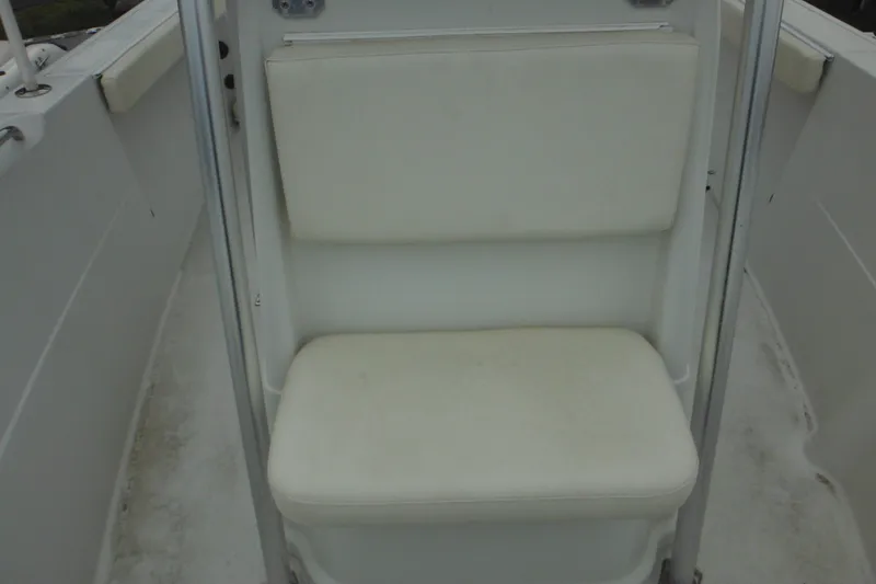 Slide: The Image of 2005 Sailfish 218 CC boat interior with white cushioned seating. - 13