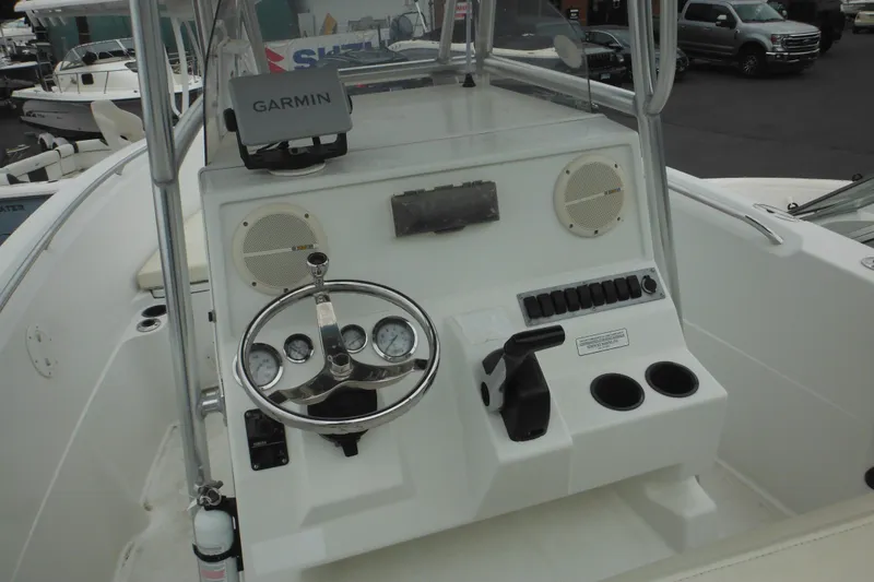 Slide: The Image of Center console of a 2005 Sailfish 218 CC boat with Garmin GPS and steering wheel. - 22