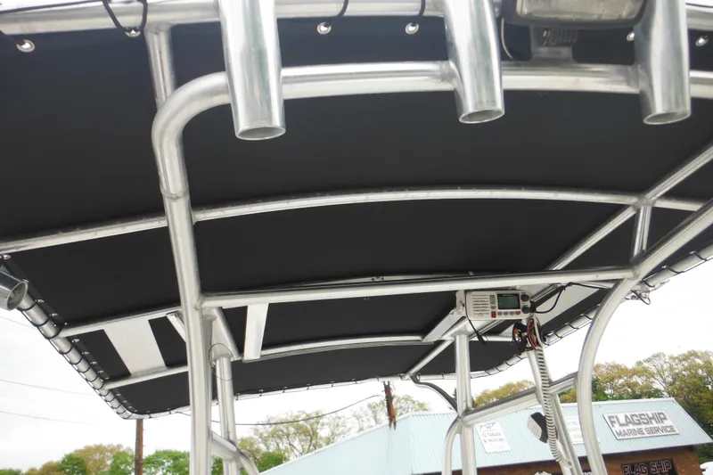 Slide: The Image of T-top of 2005 Sailfish 218 CC boat with rod holders and electronics. - 23
