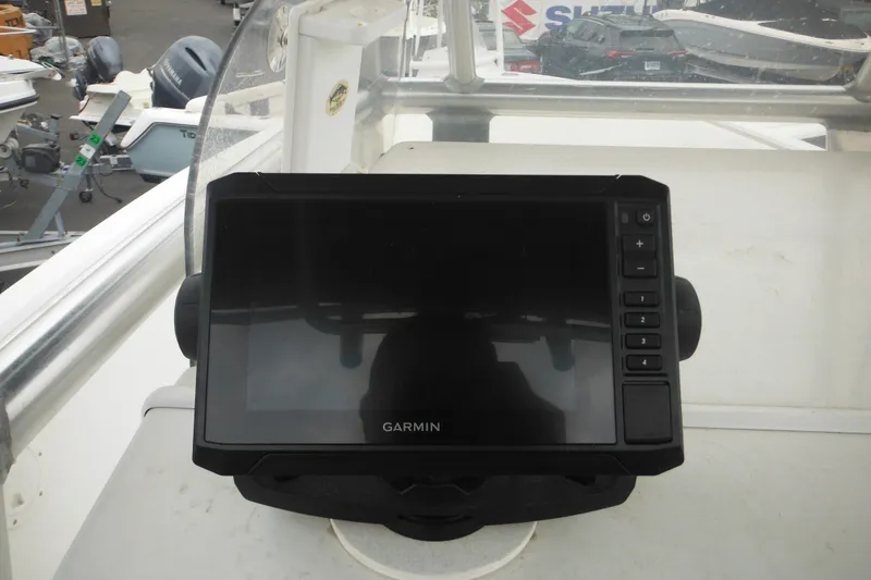 Slide: The Image of Garmin device on 2005 Sailfish 218 CC boat dashboard, surrounded by other boats. - 24