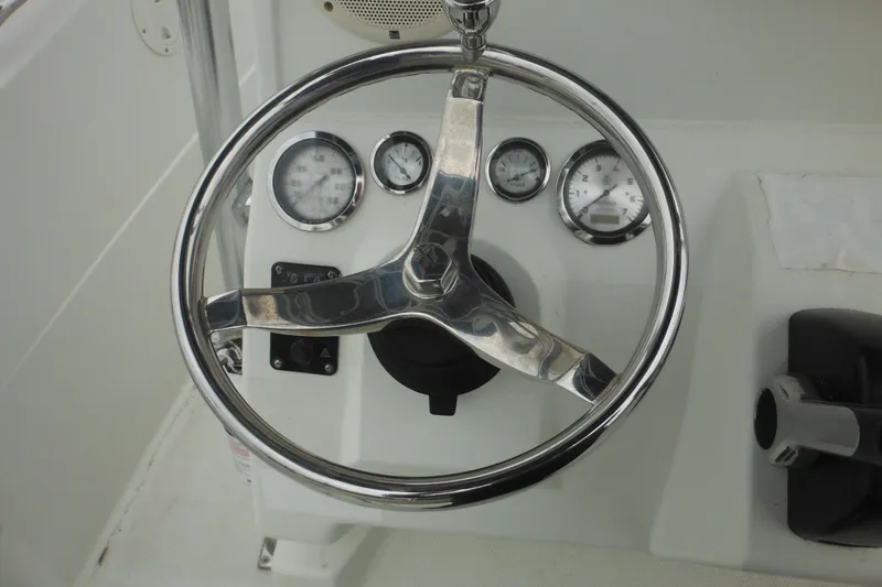 Slide: The Image of Steering wheel and gauges of a 2005 Sailfish 218 CC boat cockpit. - 27