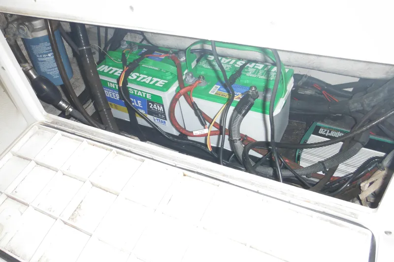 Slide: The Image of Battery compartment of a 2005 Sailfish 218 CC boat with Interstate batteries. - 31