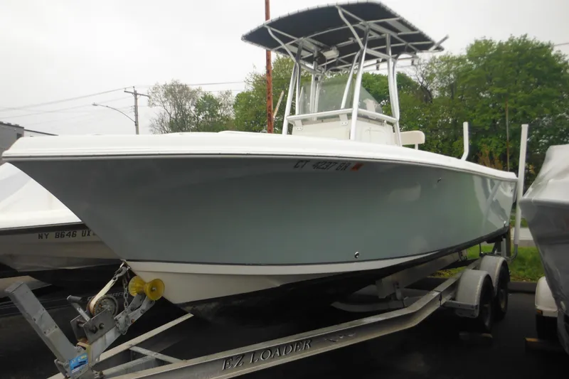 Slide: The Image of 2005 Sailfish 218 CC boat on trailer, parked outdoors. - 4