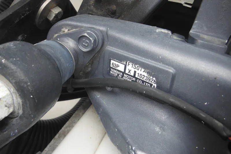 Slide: The Image of Close-up of a Yamaha motor part on a 2005 Sailfish 218 CC boat. - 9