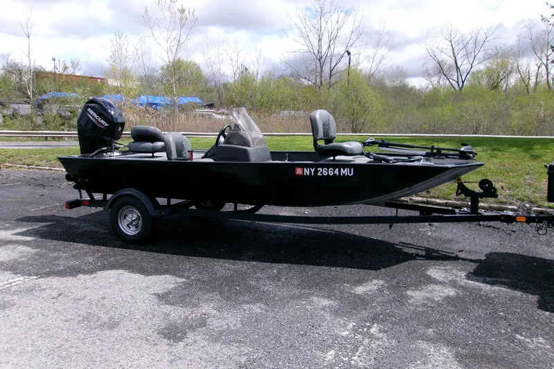 The Image of 2023 Tracker Bass Tracker Classic XL boat on trailer, parked outdoors. - 0