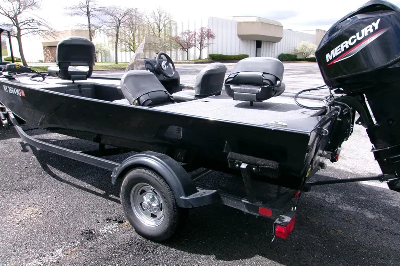 Slide: The Image of 2023 Tracker Bass Tracker Classic XL boat with Mercury engine on trailer. - 4