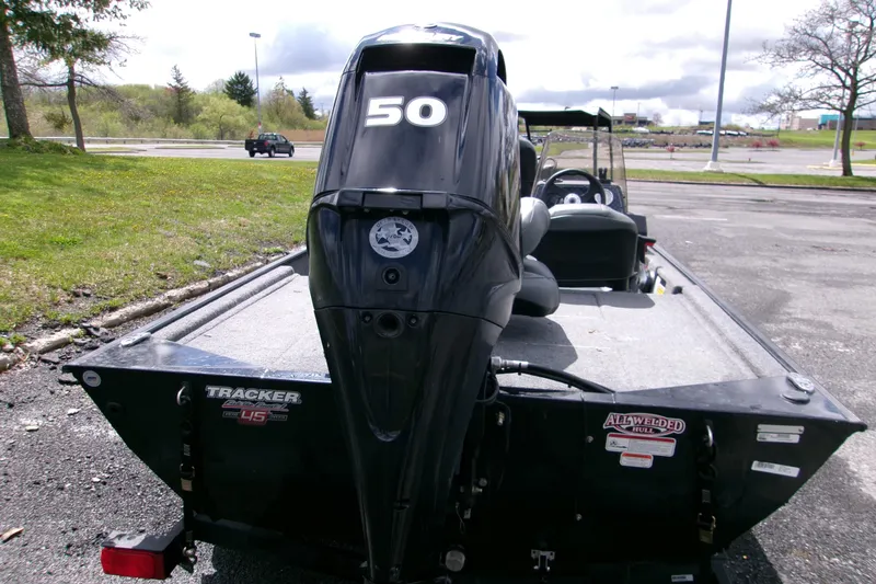 Slide: The Image of 2023 Tracker Bass Tracker Classic XL boat with 50 HP engine, parked outdoors. - 5