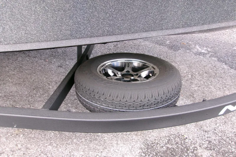 Slide: The Image of 2023 Tracker Bass Tracker Classic XL trailer with spare tire on asphalt. - 6