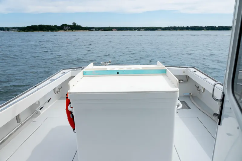 Slide: The Image of 2018 Northern Bay 38 boat deck with ocean view and storage compartment. - 18