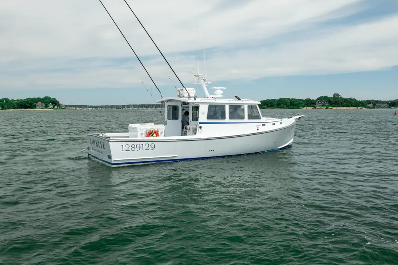 Slide: The Image of 2018 Northern Bay 38 boat on calm water, clear sky background. - 8