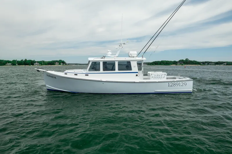 Slide: The Image of 2018 Northern Bay 38 boat on water, side view with clear sky background. - 14