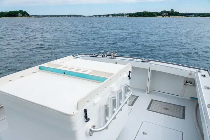 Slide: The Image of Northern Bay 38 boat deck, 2018 model, overlooking serene waters and distant shoreline. - 24