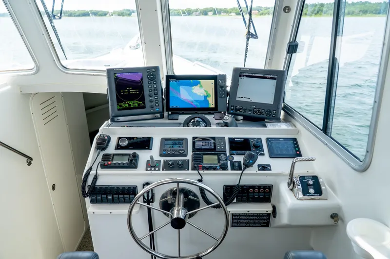 Slide: The Image of Cockpit of 2018 Northern Bay 38 boat with navigation equipment and steering wheel. - 30