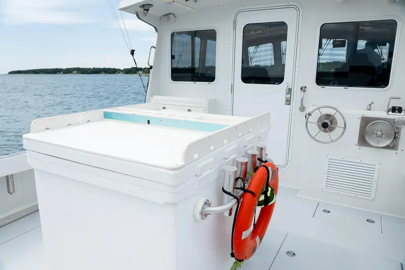 Slide: The Image of 2018 Northern Bay 38 boat deck with safety equipment and ocean view. - 21