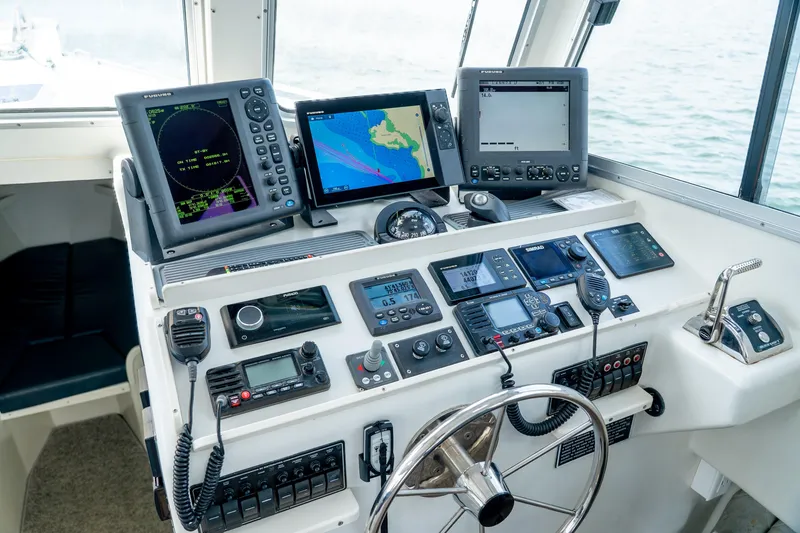 Slide: The Image of Cockpit of 2018 Northern Bay 38 boat with advanced navigation equipment and controls. - 31