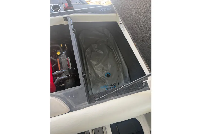 Slide: The Image of 2016 Axis A22 boat engine compartment with ballast bag visible. - 8