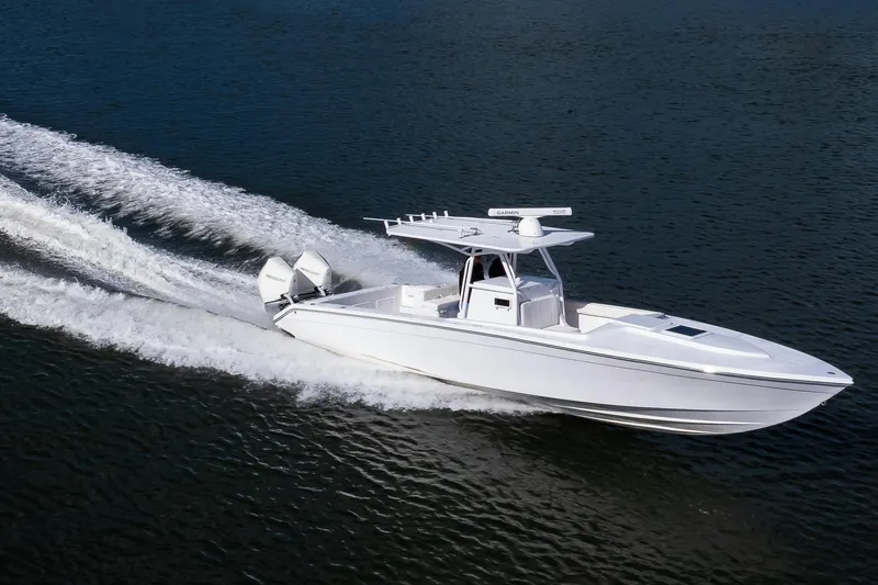 Slide: The Image of 1997 Marlago 35fs boat cruising on open water, showcasing sleek design and powerful engines. - 14