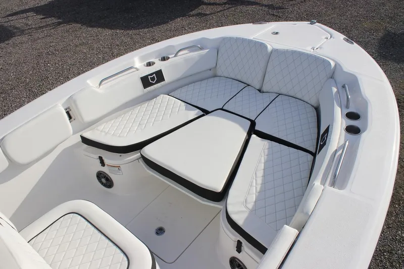Slide: The Image of 2026 Sea Fox 248 Commander boat interior with white quilted seating and cup holders. - 6
