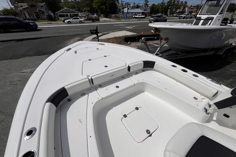 Slide: The Image of 2026 Tidewater 2300 Carolina Bay boat interior, showcasing seating and storage compartments. - 11