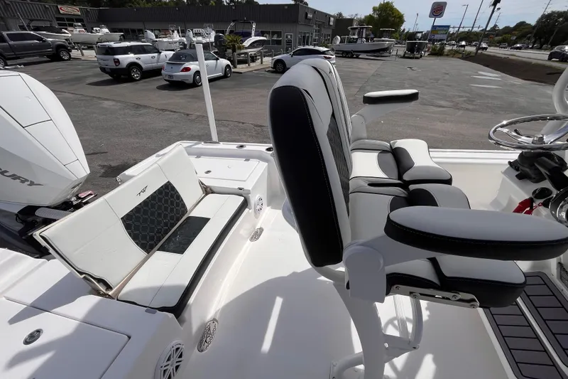 Slide: The Image of 2026 Tidewater 2300 Carolina Bay boat interior with seating and steering wheel. - 15