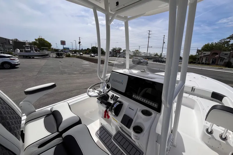 Slide: The Image of 2026 Tidewater 2300 Carolina Bay boat interior with Garmin navigation system. - 16