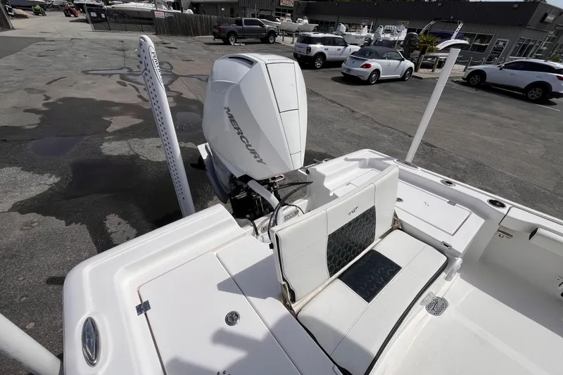 Slide: The Image of 2026 Tidewater 2300 Carolina Bay boat with Mercury engine, parked in a dealership lot. - 17