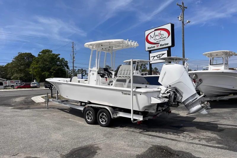 Slide: The Image of 2026 Tidewater 2300 Carolina Bay boat on trailer at Marker 17 Marine dealership. - 2