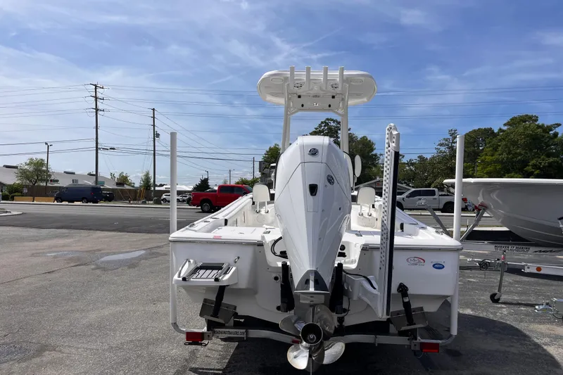 Slide: The Image of 2026 Tidewater 2300 Carolina Bay boat with outboard motor, parked on a trailer. - 3