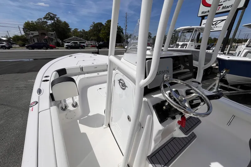 Slide: The Image of 2026 Tidewater 2300 Carolina Bay boat interior with steering wheel and seating. - 9