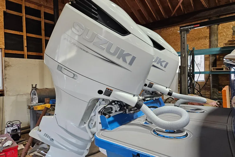 Slide: The Image of Twin Suzuki outboard engines on a 2018 Jersey Cape 31 Little Devil boat. - 3