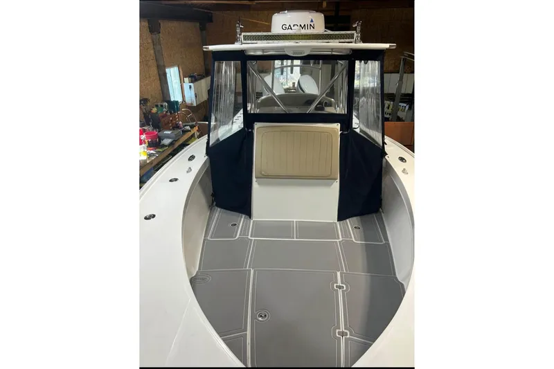Slide: The Image of 2018 Jersey Cape 31 Little Devil boat interior with Garmin equipment, featuring sleek design and spacious deck. - 5