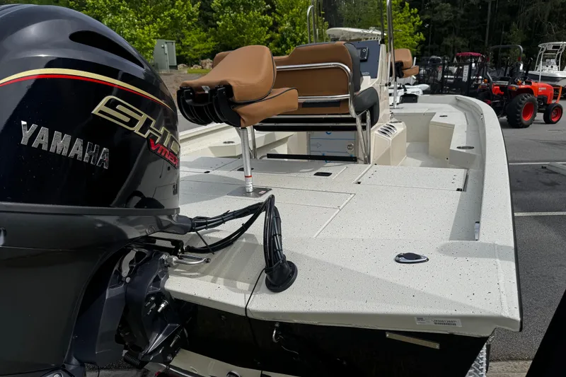 Slide: The Image of 2026 Xpress H20B Bay boat with Yamaha engine, featuring spacious deck and seating. - 13