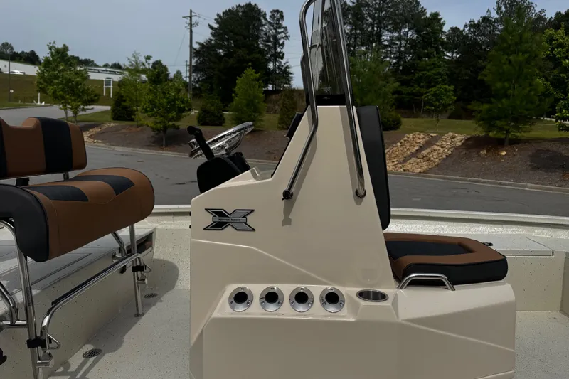 Slide: The Image of 2026 Xpress H20B Bay boat interior with steering console and seating. - 18