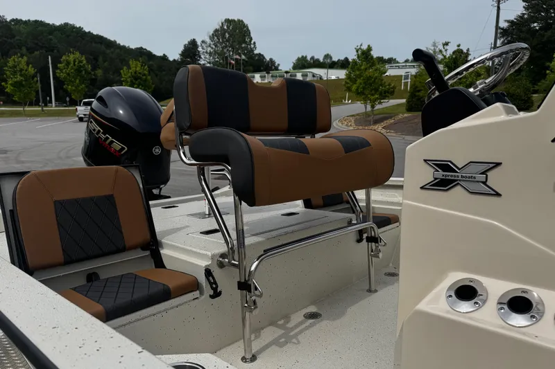 Slide: The Image of 2026 Xpress H20B Bay boat interior with seating and steering console. - 20