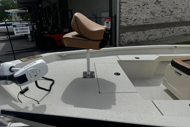 Slide: The Image of 2026 Xpress H20B Bay boat deck with seat and trolling motor. - 5