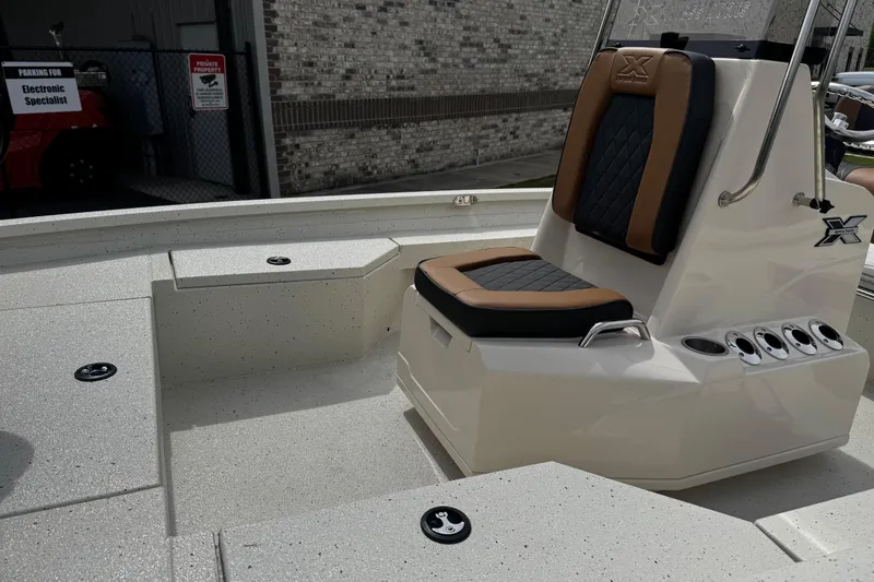 Slide: The Image of 2026 Xpress H20B Bay boat interior with cushioned seating and sleek design. - 6