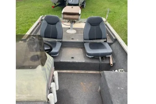 Slide: The Image of 2005 Fisher 1754 AWL boat interior with two seats and steering console. - 4
