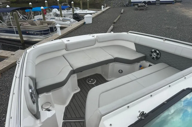 Slide: The Image of 2024 Sea Ray SDX 250 Outboard boat interior with spacious seating at dock. - 17