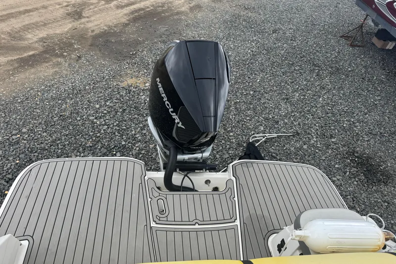 Slide: The Image of 2024 Sea Ray SDX 250 Outboard with Mercury engine on gravel surface. - 21