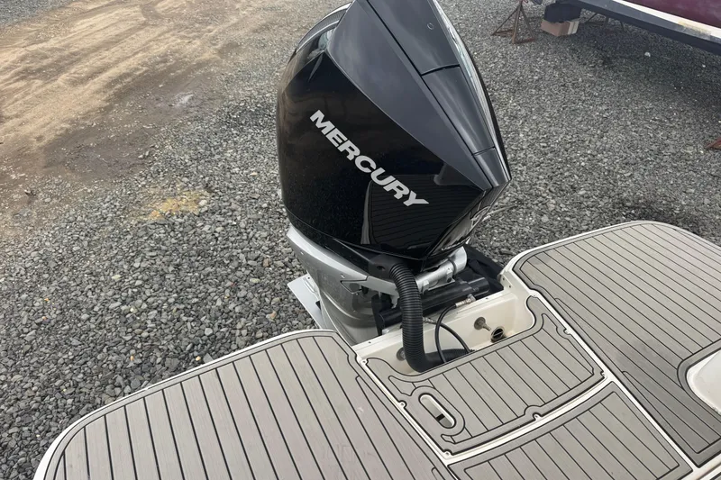 Slide: The Image of 2024 Sea Ray SDX 250 Outboard with Mercury engine on a gravel surface. - 22