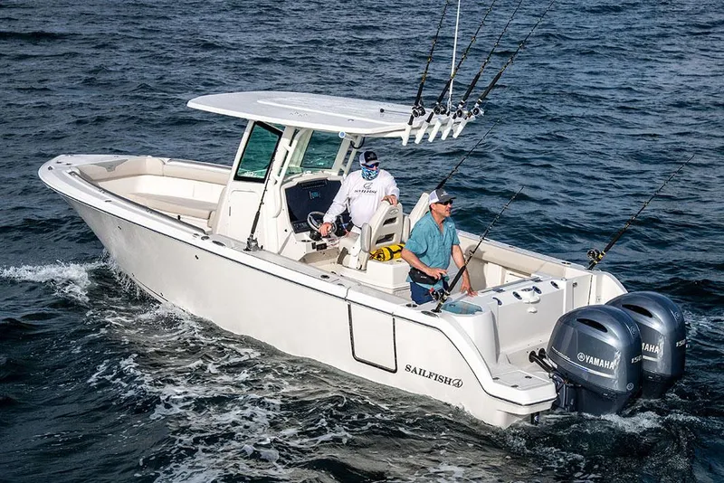 Slide: The Image of Manufacturer Provided Image: 2026 Sailfish 272 CC boat on water with two people fishing, equipped with dual Yamaha engines. - 2