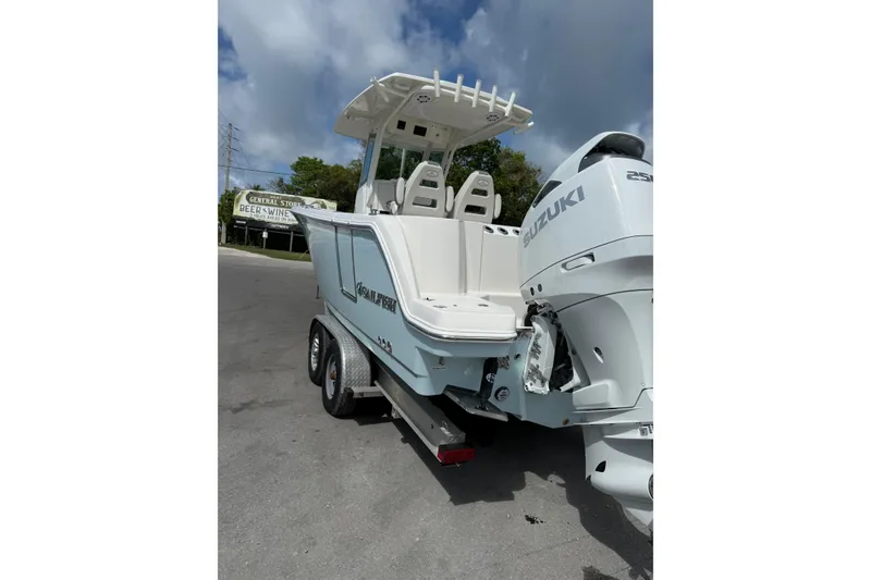 Slide: The Image of Manufacturer Provided Image: 2026 Sailfish 272 CC boat interior with white seating and storage compartments. - 9