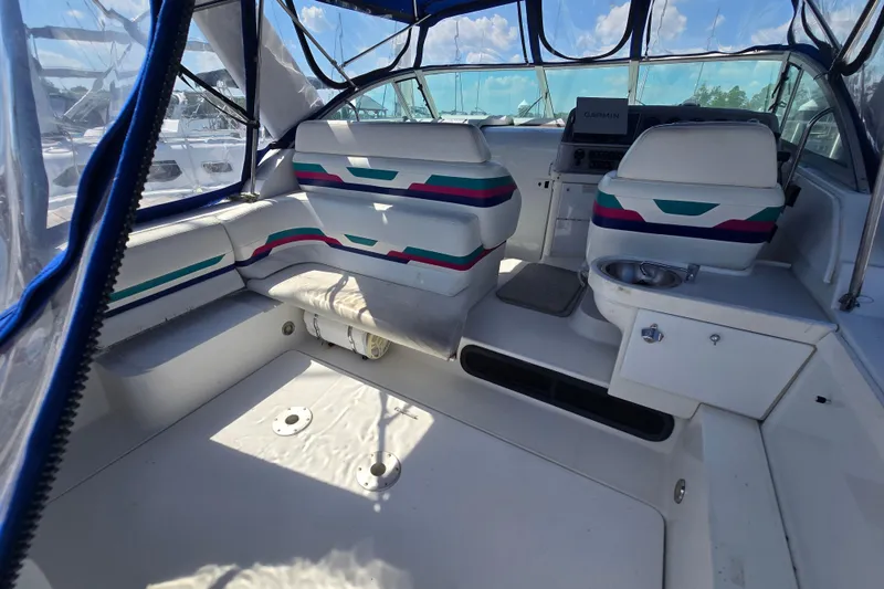 Slide: The Image of 1997 Formula 34 Performance Cruiser interior with seating and helm, featuring vibrant upholstery. - 15