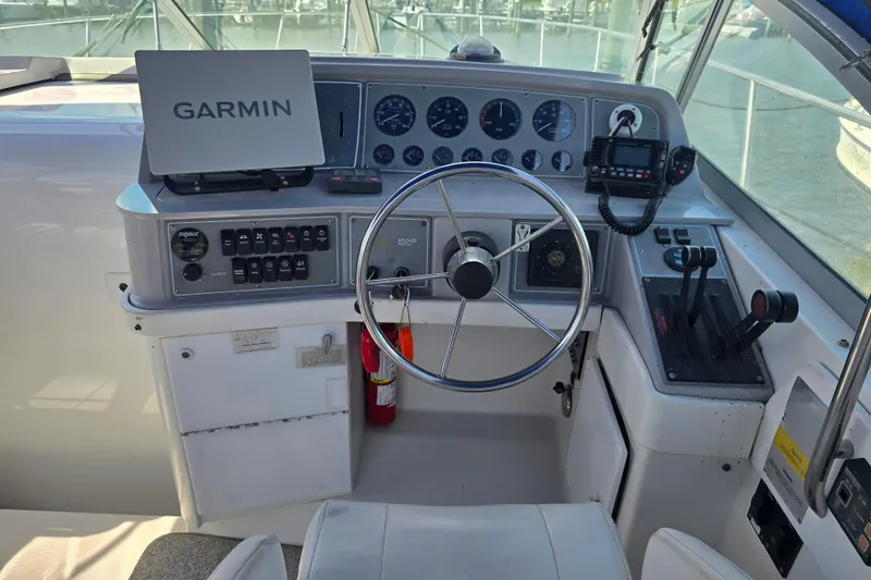 Slide: The Image of 1997 Formula 34 Performance Cruiser helm with Garmin navigation and control panel. - 16