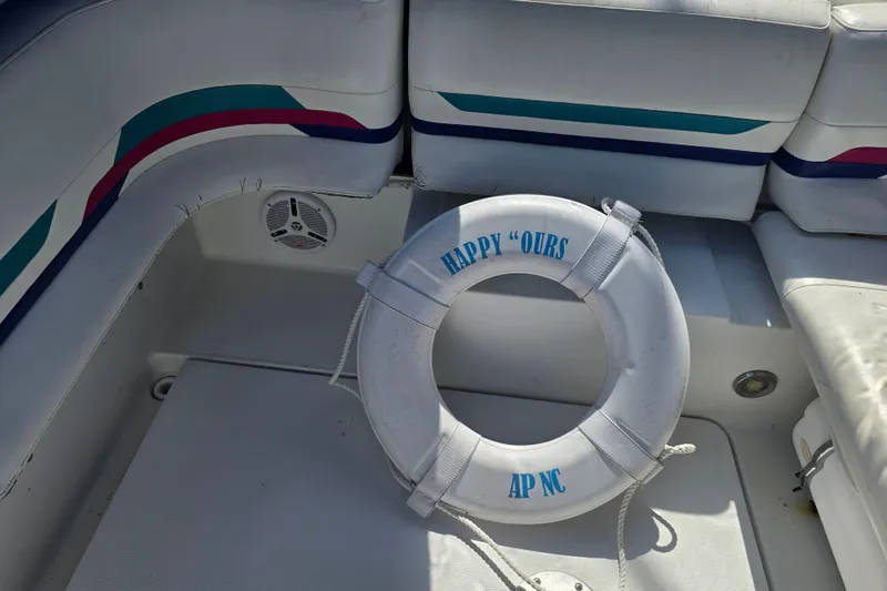 Slide: The Image of 1997 Formula 34 Performance Cruiser interior with life preserver labeled "Happy Ours." - 19