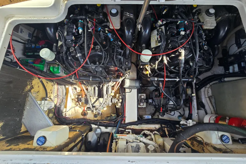 Slide: The Image of Engine compartment of a 1997 Formula 34 Performance Cruiser, showcasing dual engines and components. - 20