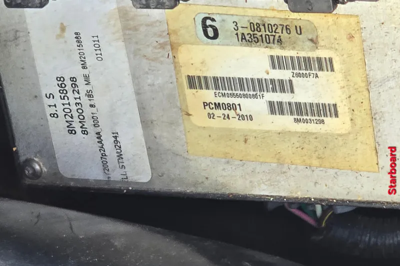 Slide: The Image of Close-up of a 1997 Formula 34 Performance Cruiser engine label with serial numbers and barcodes. - 21
