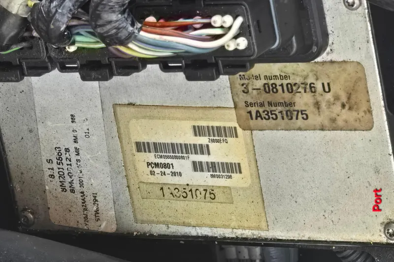 Slide: The Image of Close-up of a 1997 Formula 34 Performance Cruiser engine component with wiring and serial numbers. - 22