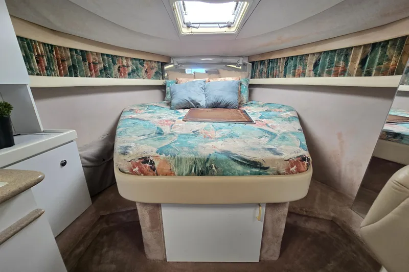 Slide: The Image of 1997 Formula 34 Performance Cruiser cabin with colorful bedding and skylight. - 27