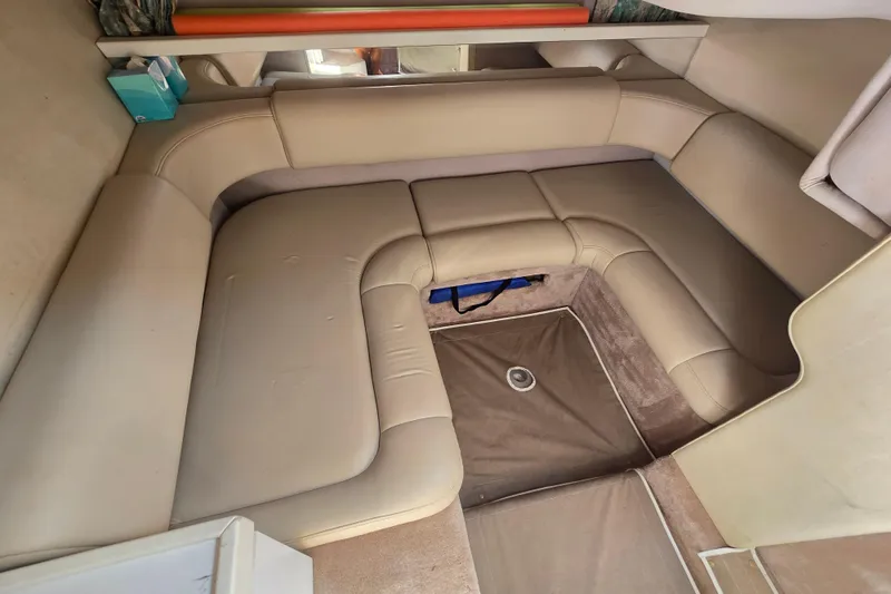 Slide: The Image of Interior of a 1997 Formula 34 Performance Cruiser with beige seating and carpet. - 30